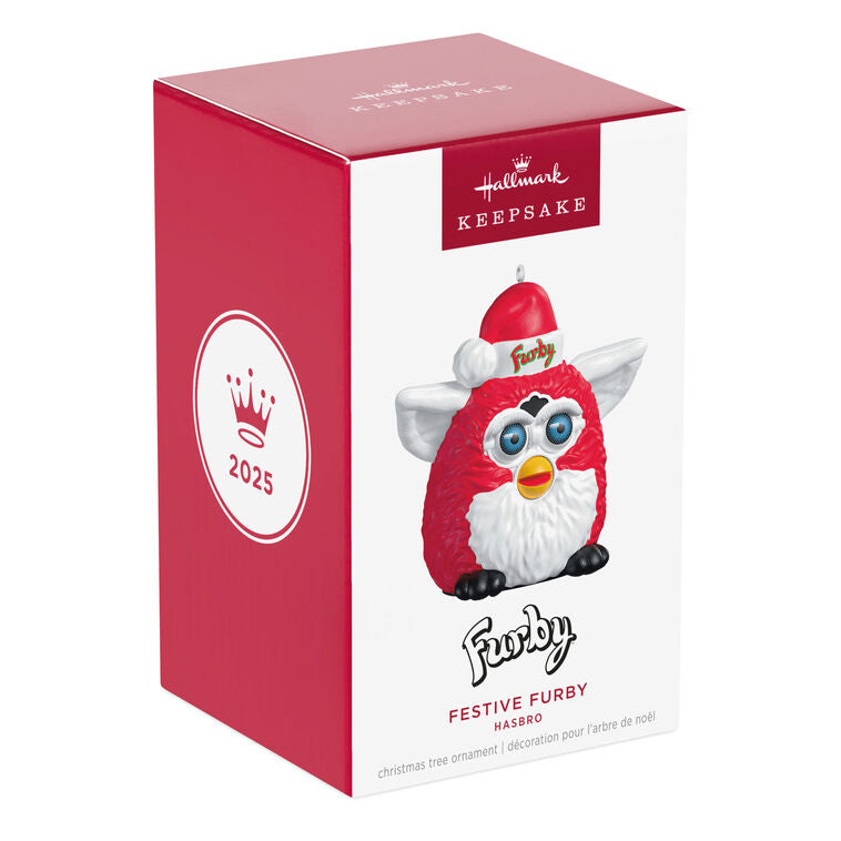 Festive Furby ornament, red and white electronic toy with blue eyes, yellow beak, Santa hat, Hallmark Keepsake, Christmas decoration.