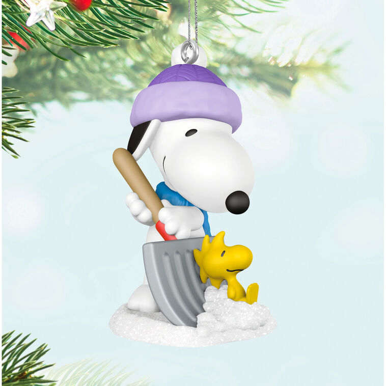Mini Snoopy ornament in purple hat and scarf shoveling snow, Woodstock riding on shovel, Hallmark Peanuts Christmas collectible