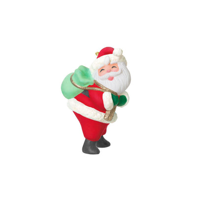 Mini Santa Claus ornament with rosy cheeks and green toy sack, retro-styled Hallmark Keepsake Christmas collectible