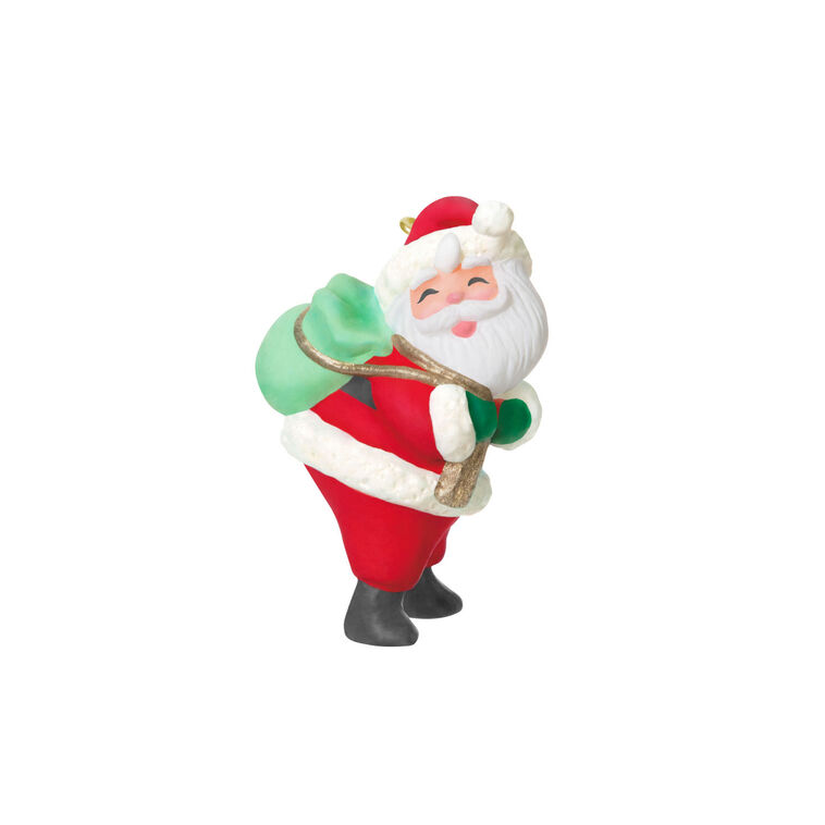 Mini Santa Claus ornament with rosy cheeks and green toy sack, retro-styled Hallmark Keepsake Christmas collectible