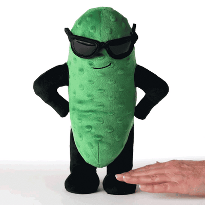 Plush dancing pickle character with sunglasses, standing with hands on hips. Press button to hear 'Sexy and I Know It' while it moves and wiggles to the music.
