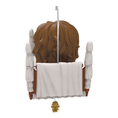 Funko POP! ornament of possessed Regan from The Exorcist in four-poster bed with spinning head motion