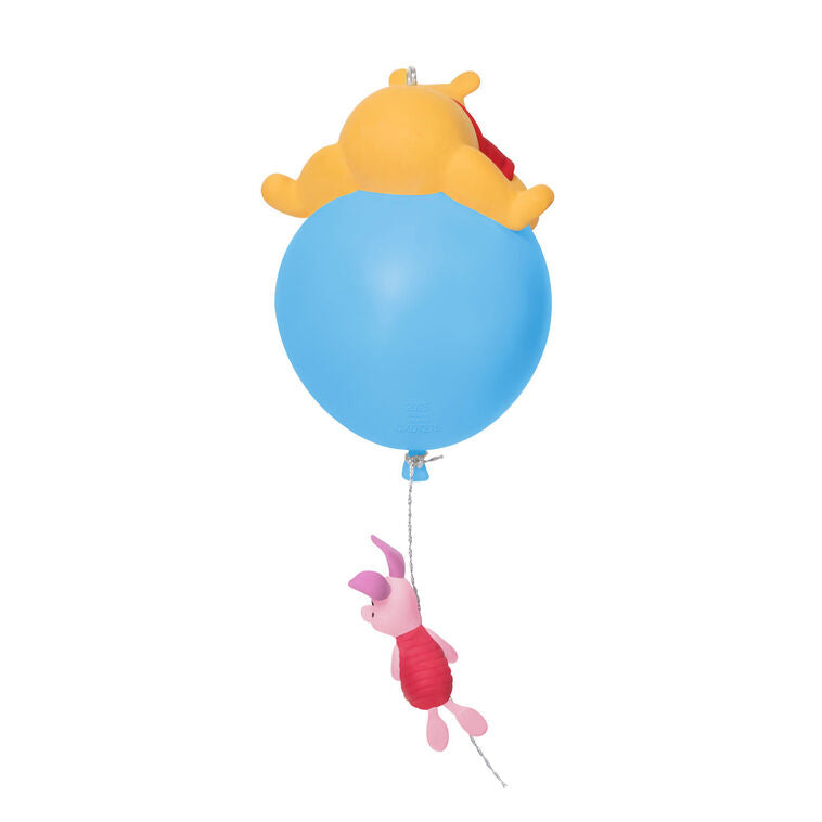 Hallmark Keepsake Disney Winnie the Pooh ornament, Pooh on blue balloon with Piglet hanging, light-up holiday tree decoration.