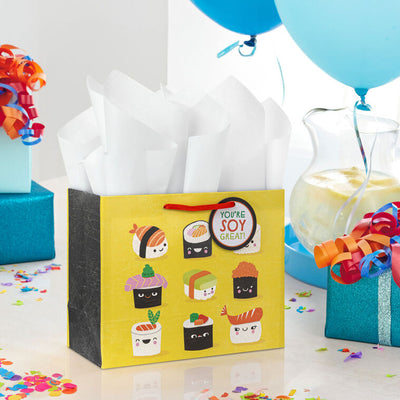 Hallmark medium gift bag with smiling sushi characters and pun text on a yellow background, perfect for fun gift occasions.
