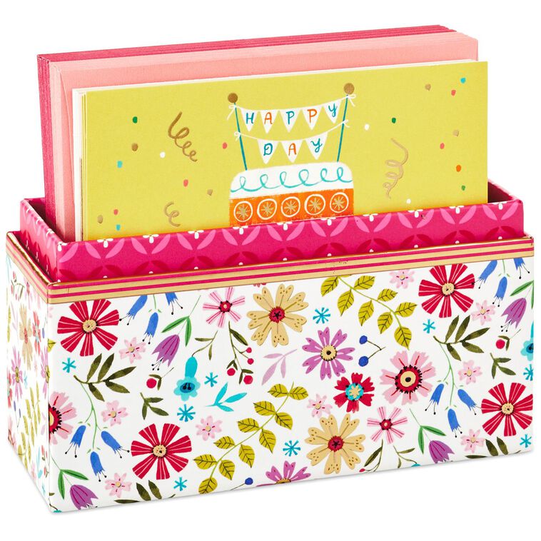 Assorted whimsical note cards with gold foil accents in multiple designs, includes envelopes and reusable caddy.