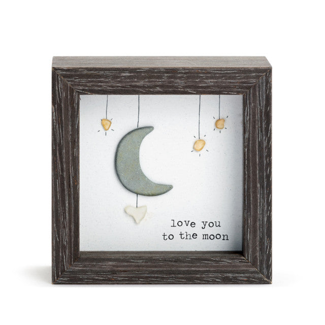 Love You to the Moon shadow box with pebble art by Sharon Nowlan, showcasing heartfelt coastal Nova Scotia-inspired design.

