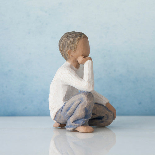 Willow Tree Inquisitive Child figurine of kneeling boy with darker skin tone and hair.