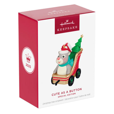 Hallmark Keepsake Cute as a Button ornament with a gray and white hamster in red sleigh, Santa hat, and Christmas tree.