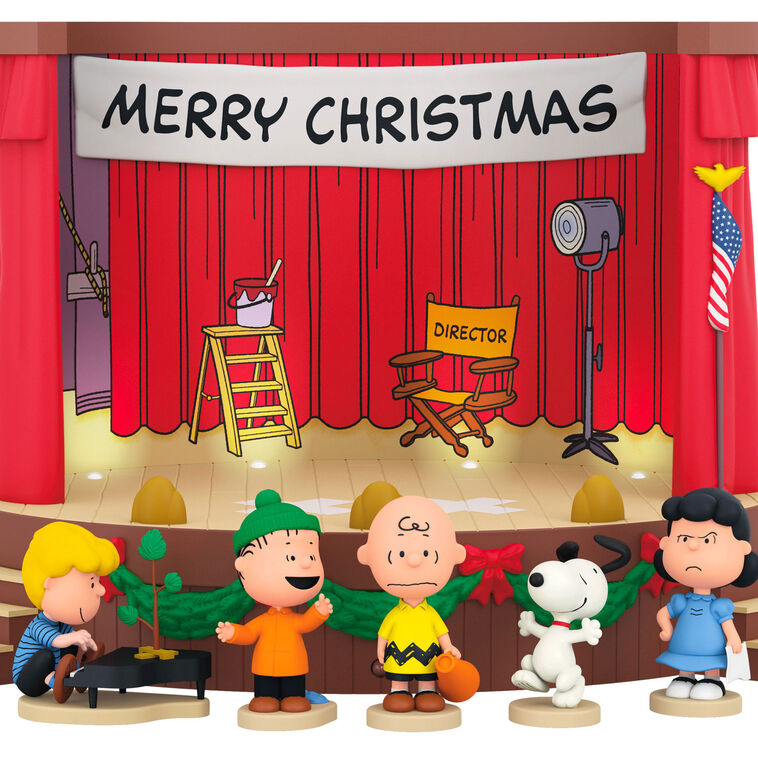 Peanuts tabletop Christmas decoration featuring Charlie Brown and friends on stage with lights and sound effects from A Charlie
