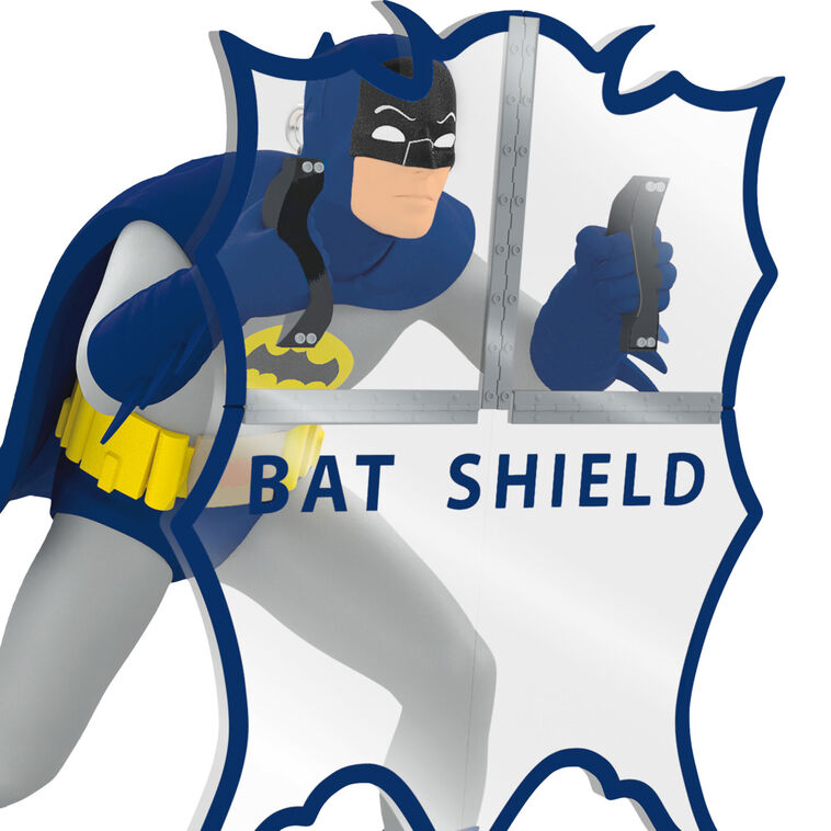 Batman ornament holding Bat-Shield from 1960s TV series, blue and gray costume with yellow accents, nostalgic superhero decoration