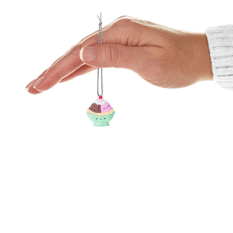 Miniature banana split ornament with chocolate and strawberry ice cream scoops, whipped cream, and cherry, Hallmark Keepsake
