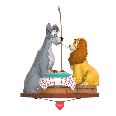 Lady and the Tramp 70th anniversary ornament featuring the Cocker Spaniel and stray dog sharing a spaghetti supper.

