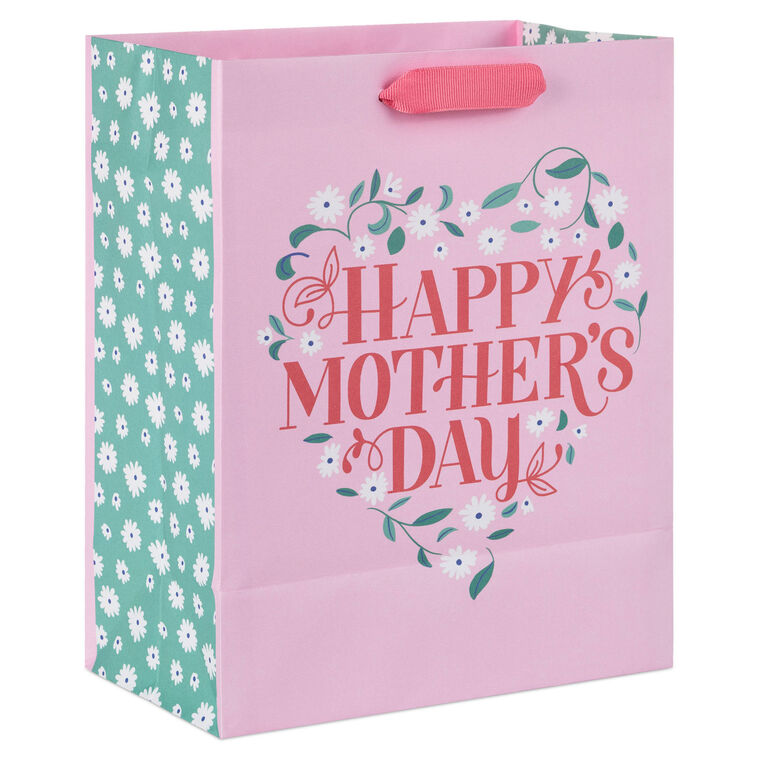 Hallmark medium pink gift bag with floral heart design, green vine, white flowers, and Happy Mother&