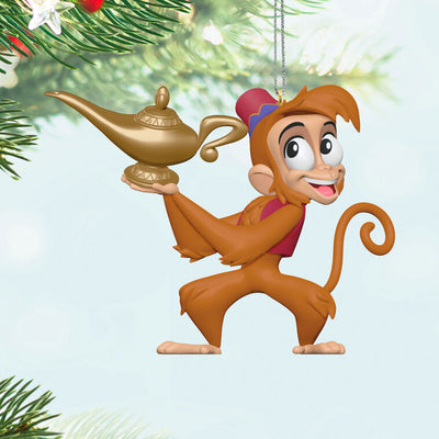 Abu the monkey from Disney’s Aladdin holding the magic lamp in a festive Christmas tree ornament