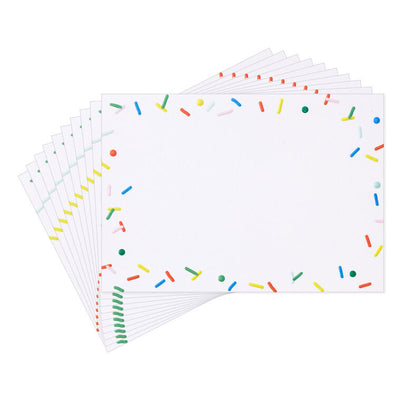 White flat note cards with colorful confetti sprinkle border design, bundled in kraft paper wrap.
