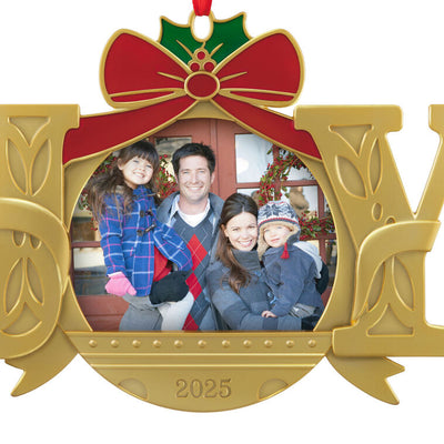 Gold JOY word-art photo frame ornament with red bow and holly topper, features 2025 date and holds a small holiday photo.