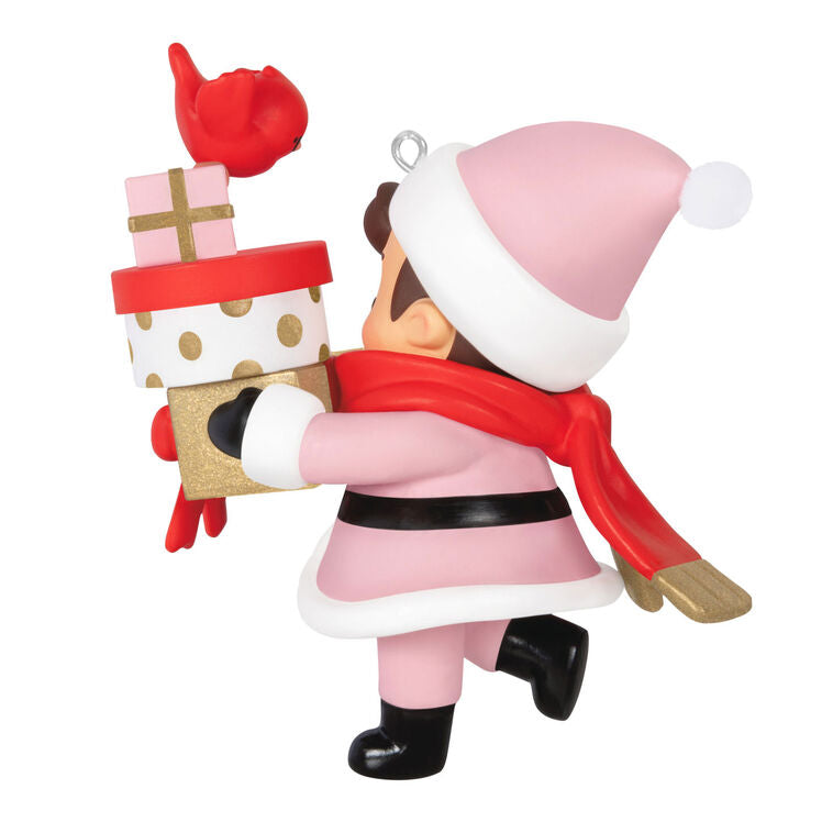 Mystery ornament featuring Young Santa in festive outfit holding presents and a bird, blind-boxed surprise