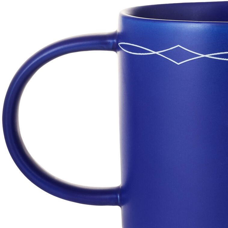 Cobalt blue ceramic mug with white text that reads “This ain&