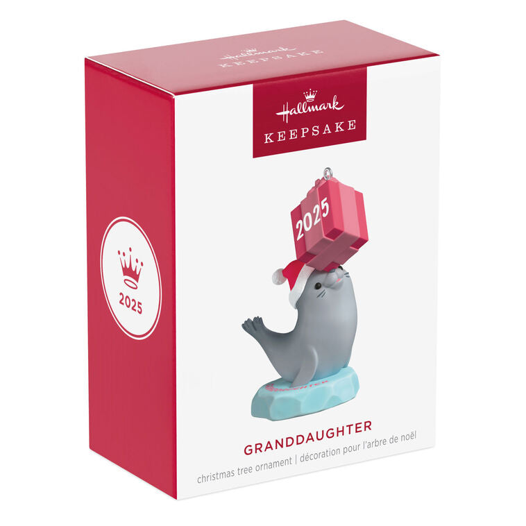 2025 Christmas ornament with gray seal in Santa hat on iceberg, balancing pink present on nose, festive design

