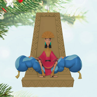 Emperor Kuzco ornament sitting on plush throne from Disney’s The Emperor’s New Groove holiday collection.

