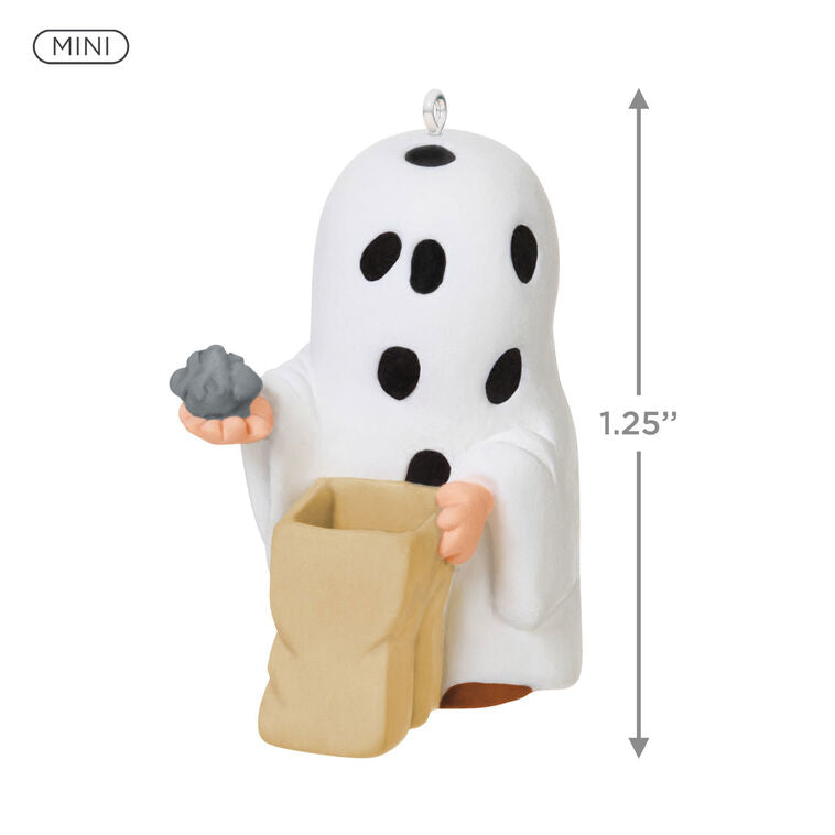 Miniature Charlie Brown Halloween ornament dressed as ghost holding rock from Peanuts Gang