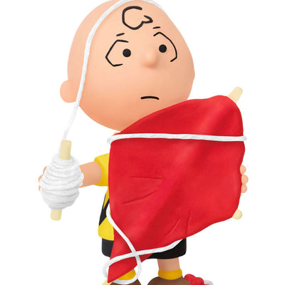 Mini Charlie Brown ornament tangled in red kite string, celebrating 75th anniversary, Hallmark Peanuts Christmas collectible
