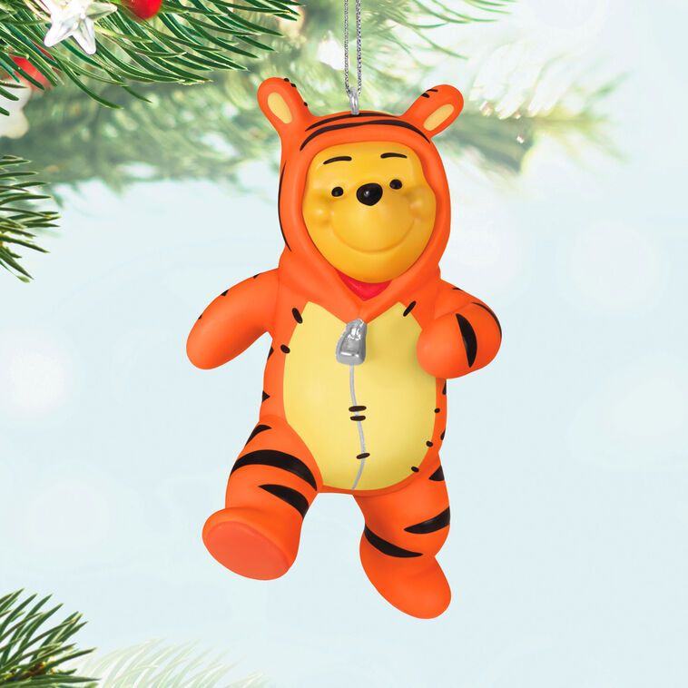 Winnie the Pooh ornament dressed in a striped orange Tigger costume with hood and bouncing pose