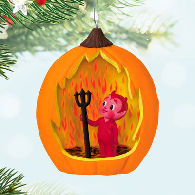 Halloween ornament with jack-o'-lantern and friendly devil holding pitchfork against red flame backdrop