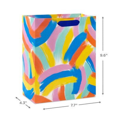 Hallmark medium gift bag with colorful abstract brushstroke rainbows in purple, blue, yellow, and orange on a white background