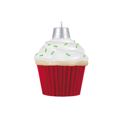 Mini cupcake-shaped ornament with Mrs. Claus waving from a silver-dotted doorway, topped with white icing and green sprinkles.