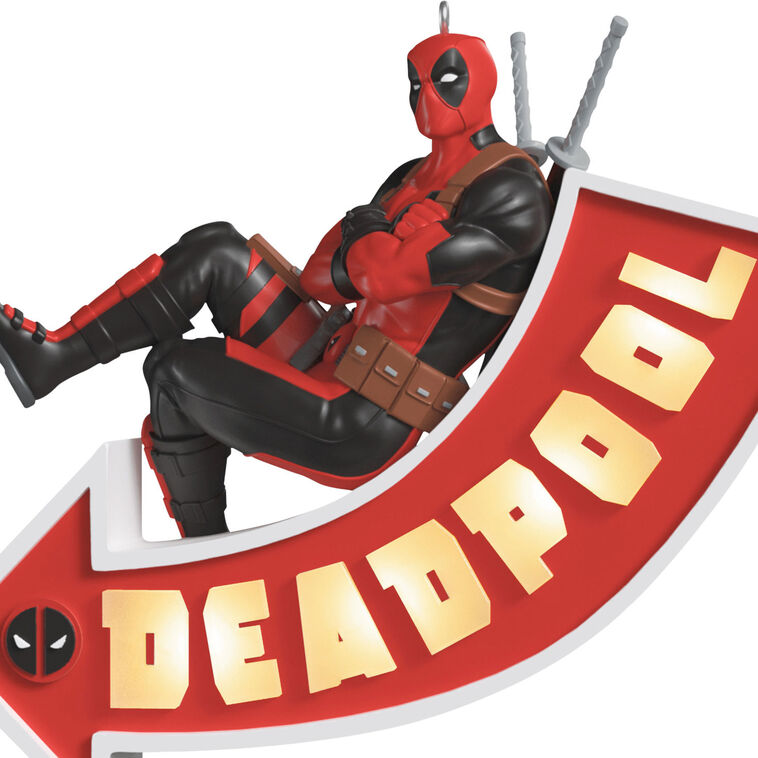 Deadpool ornament, Marvel character in red and black suit, arrow sign marquee, Hallmark Keepsake, Christmas decoration, light-up feature.