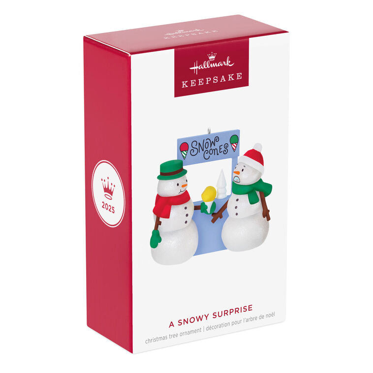 Humorous snowman Christmas ornament offering yellow snow cone to surprised snowperson