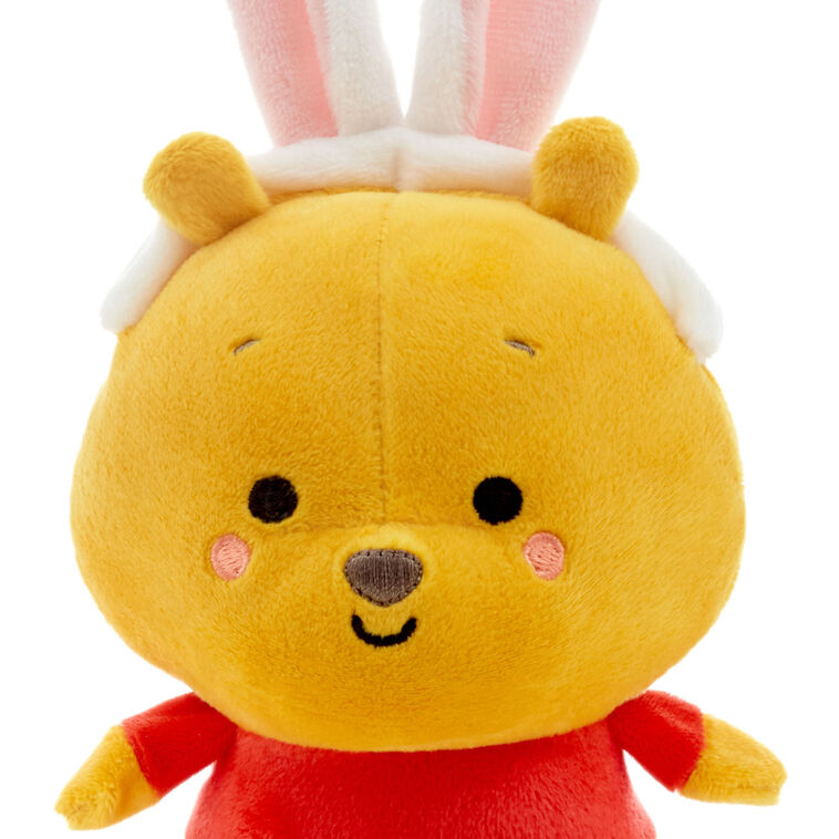 Disney plush Pooh in bunny ears and Piglet in an Easter egg outfit with magnetic connectors for spring gifting.
