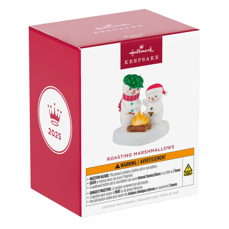 Two snowmen in red and green hats roasting marshmallows over a fire, sparkly base, musical Christmas ornament, battery opera
