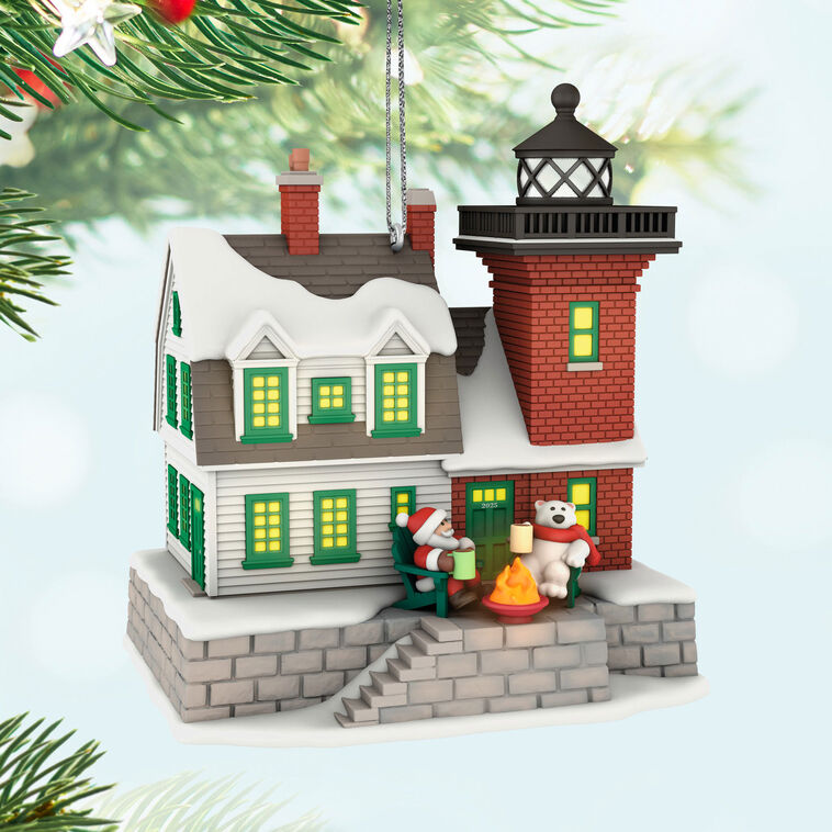 Hallmark Keepsake ornament of a brick lighthouse and home with Santa and polar bear, glowing windows and beacon, Holiday Lighthouse 2025