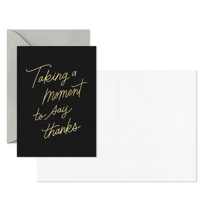 Black thank-you cards with elegant gold foil script reading “Taking a moment to say thanks.”
