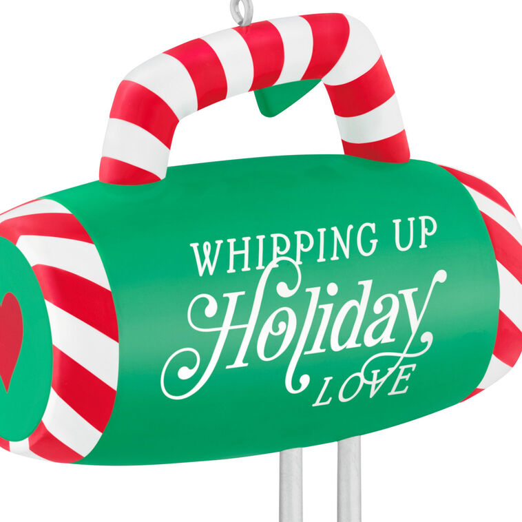 Green hand-mixer Christmas ornament with candy cane stripes and heart-shaped beaters, festive holiday kitchen decor


