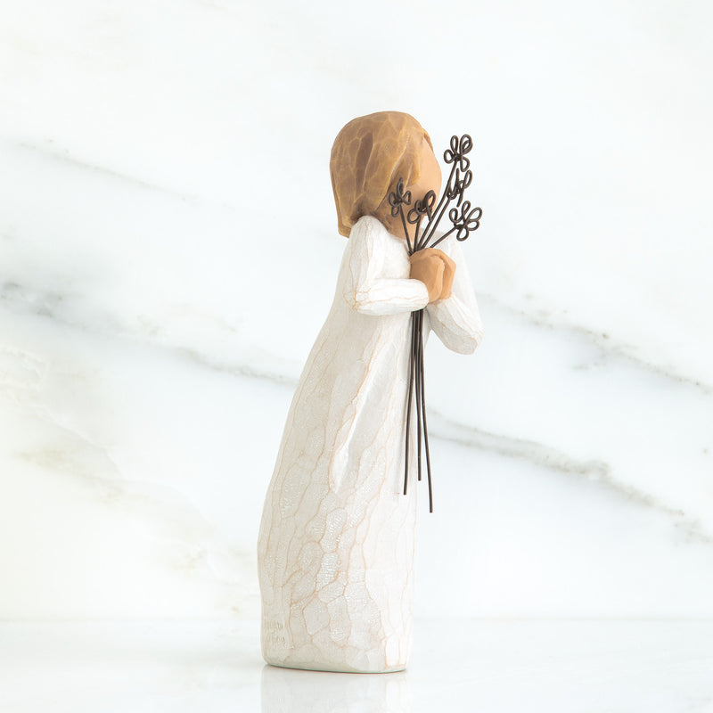 Willow Tree Friendship figurine holding five wire flowers in cream dress.