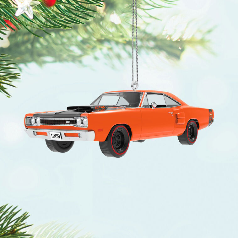 1969 Dodge Super Bee die-cast metal ornament in orange with black racing stripes, redline tires, and turning wheels.