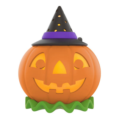 Mini jack-o'-lantern tree topper with light and sound, glows and plays music for Halloween display