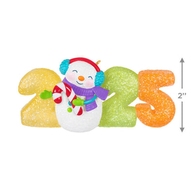 Hallmark Keepsake Sweet Decade 2025 ornament—snowman in purple scarf and blue earmuffs with candy cane, surrounded by glittery gumdrop “2025” numbers