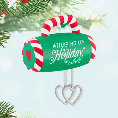 Green hand-mixer Christmas ornament with candy cane stripes and heart-shaped beaters, festive holiday kitchen decor

