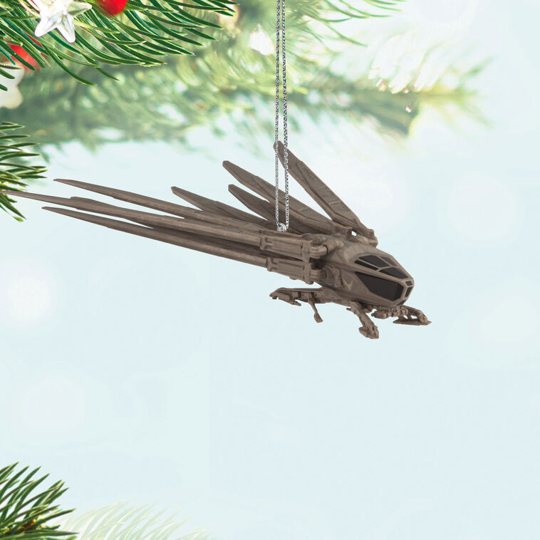 Die-cast Dune ornament of Atreides ornithopter aircraft with folding wings and bird-like shape.