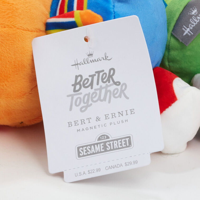 Plush Bert and Ernie toys with magnetic connectors, colorful outfits, and embroidered Sesame Street features.
