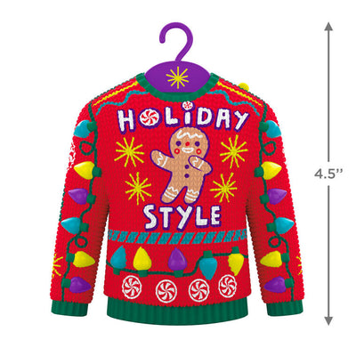 Red and green Christmas sweater ornament with gingerbread man, candy, and lights, plays "Carol of the Bells."


