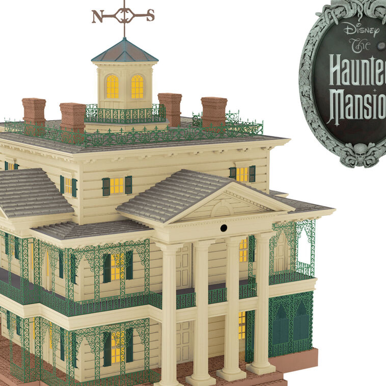 Disney Haunted Mansion tree topper with synchronized light and sound show, remote control activation, and glowing Disney