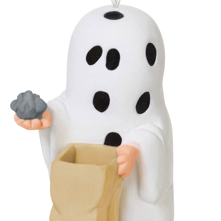 Miniature Charlie Brown Halloween ornament dressed as ghost holding rock from Peanuts Gang