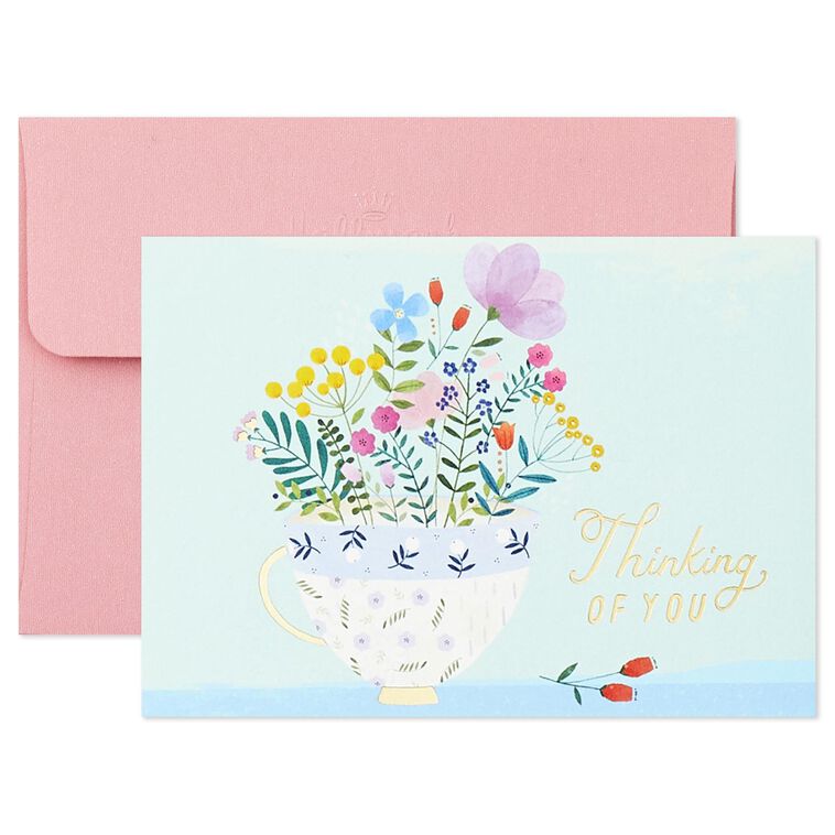 Assorted whimsical note cards with gold foil accents in multiple designs, includes envelopes and reusable caddy.