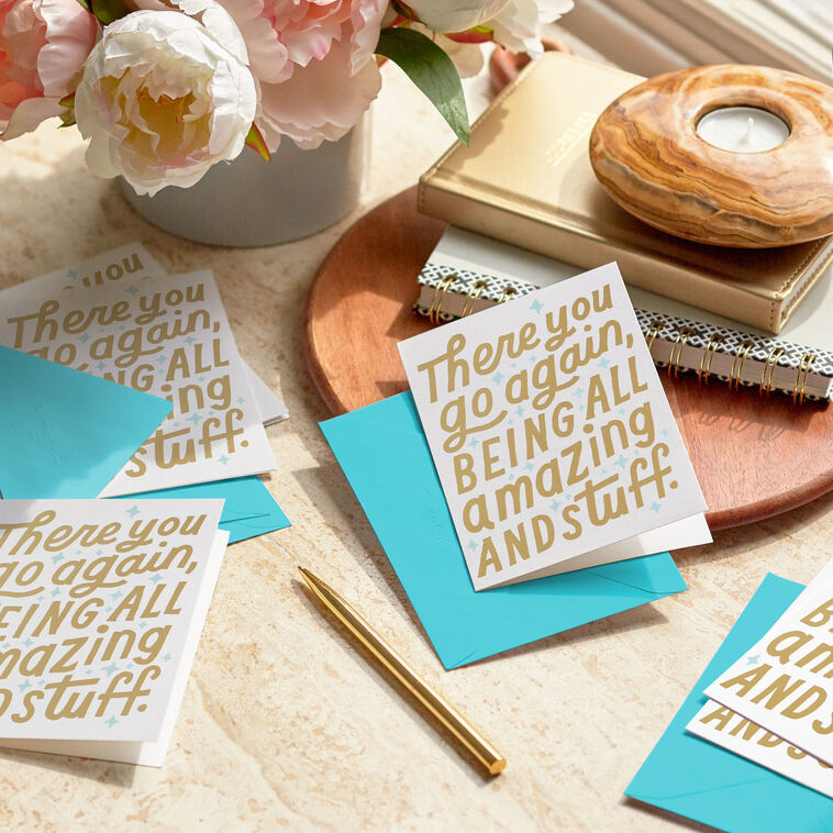 White thank you cards with gold foil block lettering that reads there you go again being all amazing and stuff, includes aqua-lined envelopes