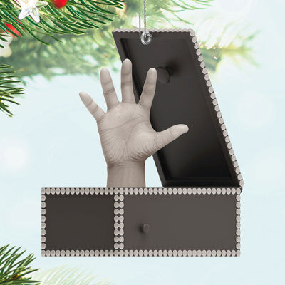 Musical ornament of Thing hand in box from The Addams Family TV show, plays theme song when button is pressed